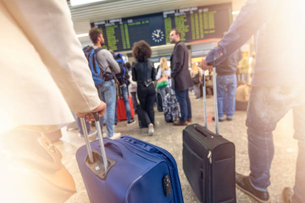 istock People waiting at an airport 954782144