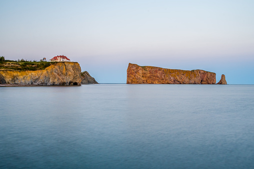 Percé Rock with sunset light as viewed from the town of Percé (Canada Québec)