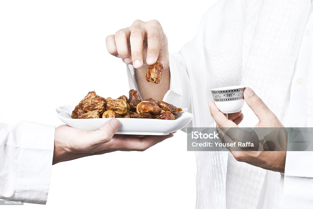 Arabian Man Picking Dates  Coffee - Drink Stock Photo