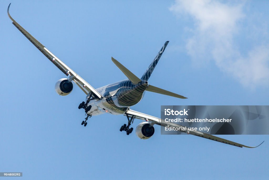 Airbus A350 XWB plane flies at airport Berlin / Schoenefeld. Berlin / Germany - April 28, 2018:  Airbus A350 XWB plane flies at airport Berlin / Schoenefeld. The Airbus A350 XWB is a family of long-range, twin-engine wide-body jet airliners. 3.5-liter V6 Stock Photo
