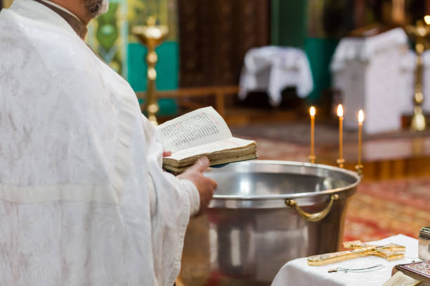 istock priest says a prayer in the church 954802282