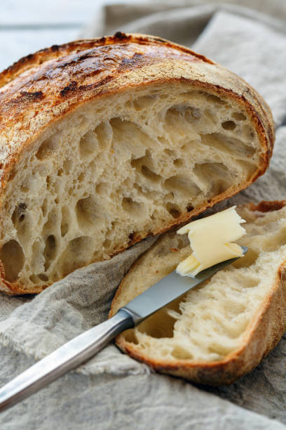 istock Cut a loaf of artisanal bread on sourdough. 954804734