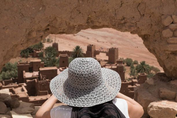 istock Woman walking through a mud village in Morocco 954805048