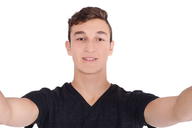 istock Portrait of a young man taking a selfie 954805260