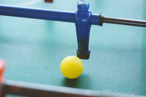 istock Soccer table game, blue foosball player. 954805280