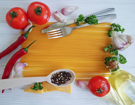 Madrid Spain. September 21, 2020. Vegetable stir-fry on white square dish on white table. Garlic cloves around