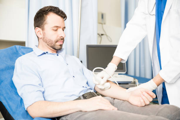 istock Patient having an ultrasound on the arm 954809224