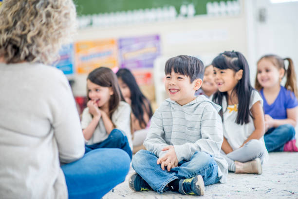 istock Preschool kids laughing as a group 954812592