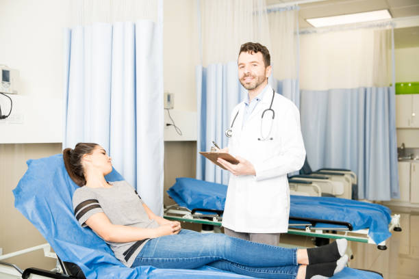 istock Doctor treating female patient 954812730