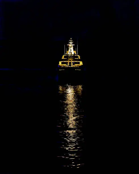 Ship's  Golden Reflexions at Night in the Sea. Stock Image.