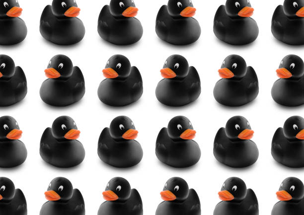 Seamless pattern of black rubber ducks in isolated background