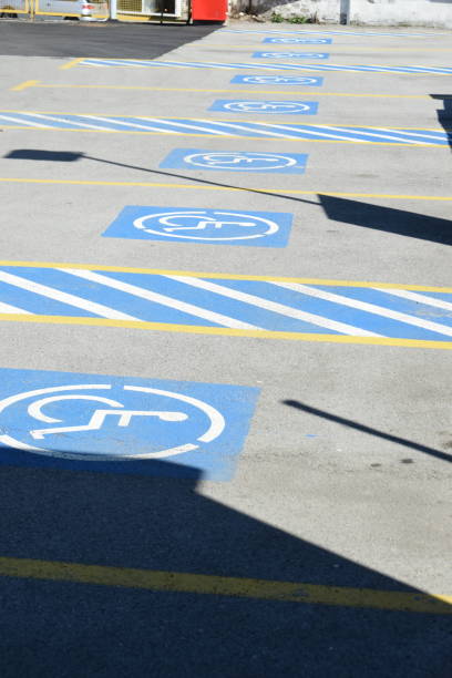 istock Parking places reserved for vehicles that drive disabled people 954826302