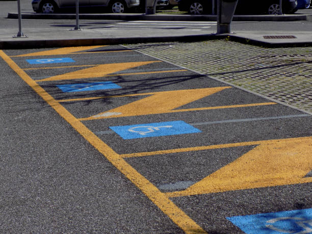 istock Parking places reserved for vehicles that drive disabled people 954826326