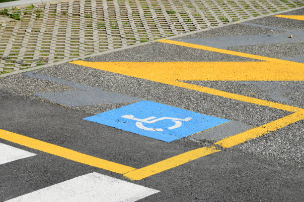 istock Parking places reserved for vehicles that drive disabled people 954826344