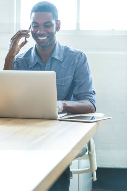 istock African American man working on a laptop computer. 954826420