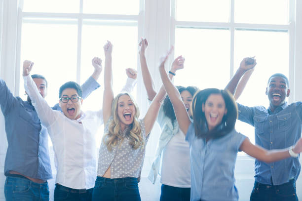 istock Group of young multi cultural business people celebrating. 954826436