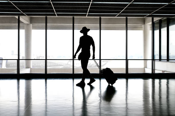 istock Man in has in airport 954830324