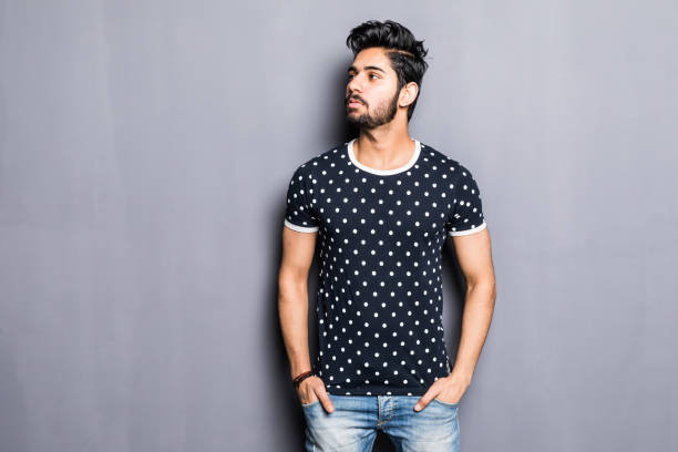 istock Indian man in t-shirt over gray background 954833368