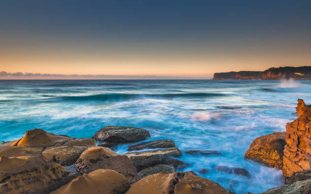 istock Rocky Dawn Seascape 954838626