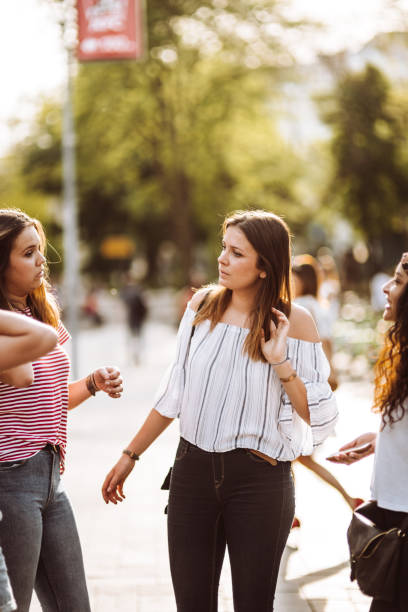 istock teens friends walking in the city 954839538