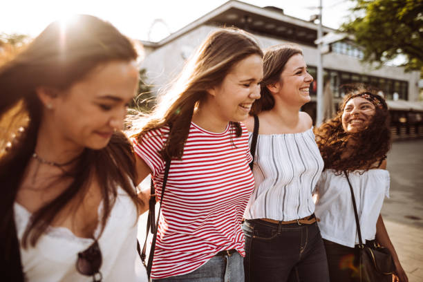 istock teens friends walking in the city 954839576