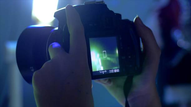 istock Spectator Girl Shooting On Camera 954844488