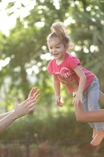 istock child girl playing at playground 954847018