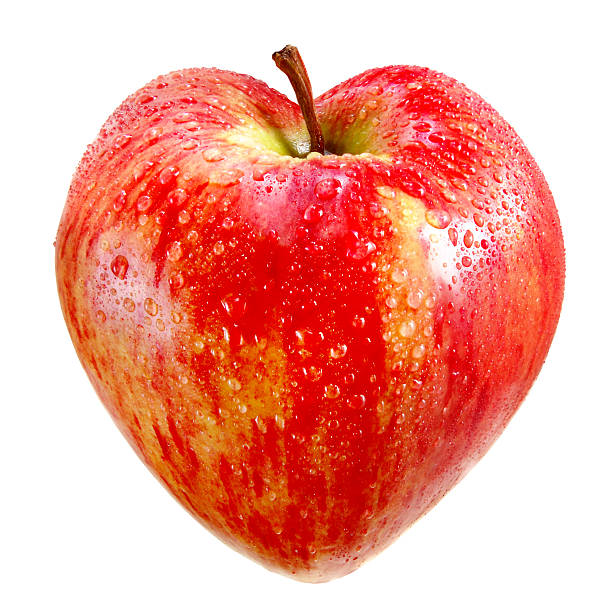 red apple in a heart stock photo