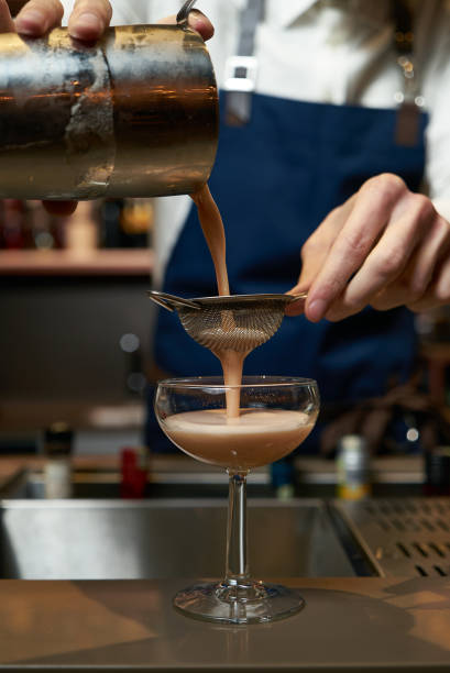 istock Professional bartender making a cocktail at the bar counter 954848670