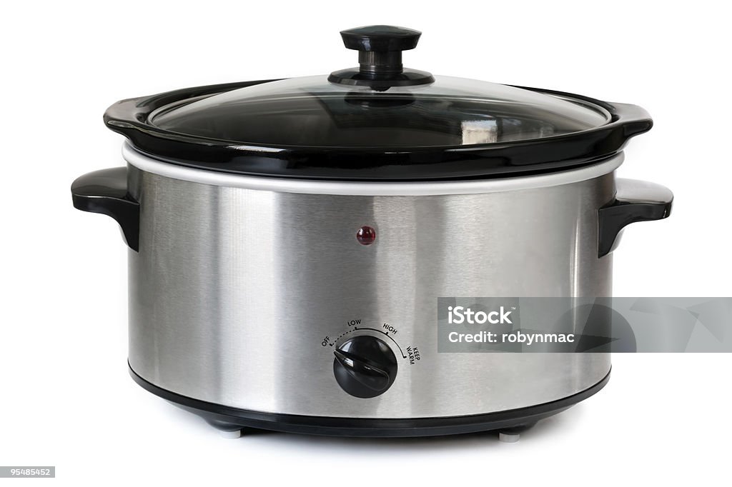 Isolated picture of a silver crock pot Electric crock pot or slow cooker, isolated on white. Crock Pot Stock Photo