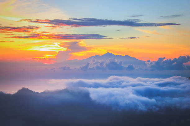istock Golden sunrise above the clouds 954859668