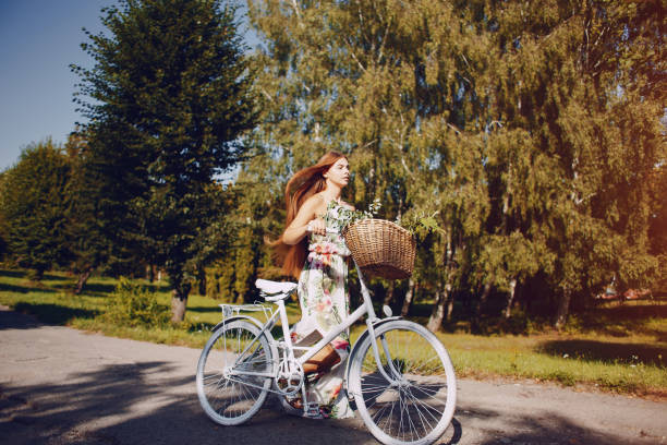 istock Girl with a bike 954859812