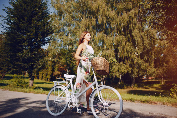 istock Girl with a bike 954859854