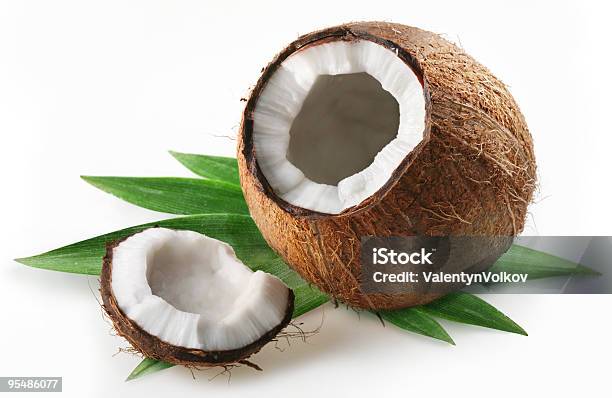 Coconut With Leaves On A White Background Stock Photo - Download Image Now - Broken, Coconut, Color Image