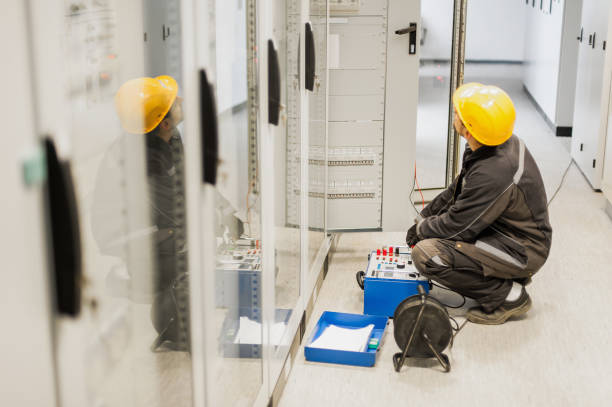 Electrician engineer tests system with relay test set equipment Electrician engineer tests system with relay test set equipment. Relay and protection testing coupling stock pictures, royalty-free photos & images