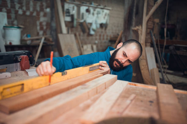 istock Young carpenter working in the the shop 954884080
