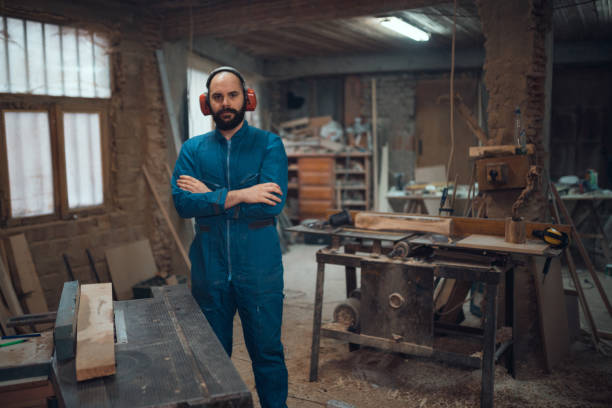 istock Young carpenter working in the the shop 954884090