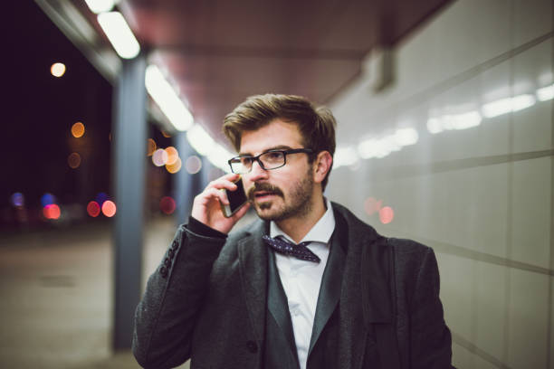 istock Handsome young man having a phone call in front of the office 954884240