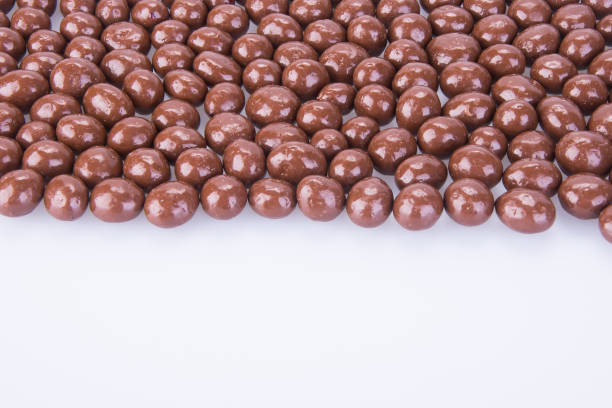 istock chocolate balls. chocolate balls on a background. 954885398