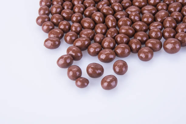 istock chocolate balls. chocolate balls on a background. 954885444