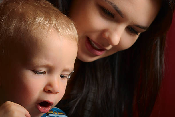 istock Mother and child reading together 95489178