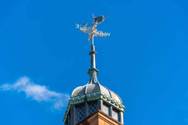 detail of church dome with decoration and gold cross. Taurasi, Avellino, Italy.