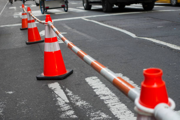 istock street cones with connecting block off bars 954901960