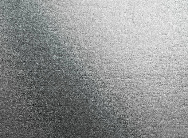 istock abstract background. shiny gray of silver foil texture 954905478