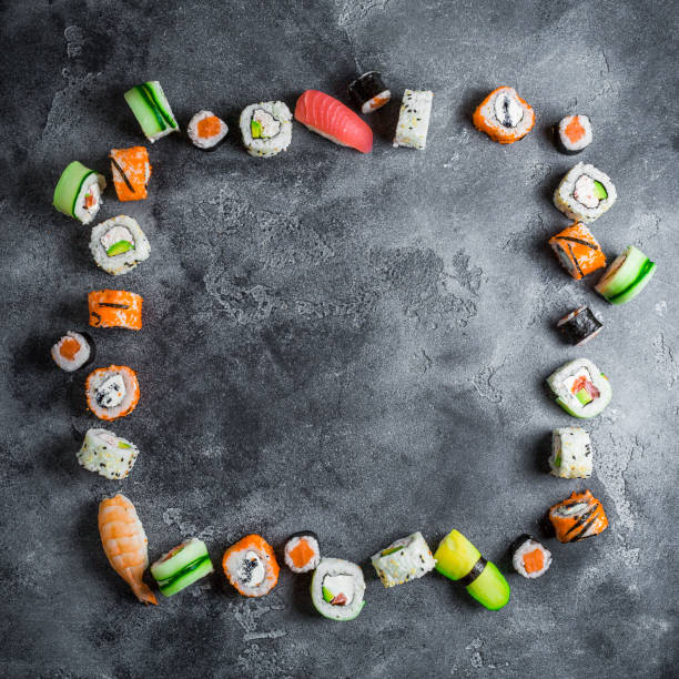 Food frame of sushi rolls on a dark background. Japanese food. Flat lay. Top view