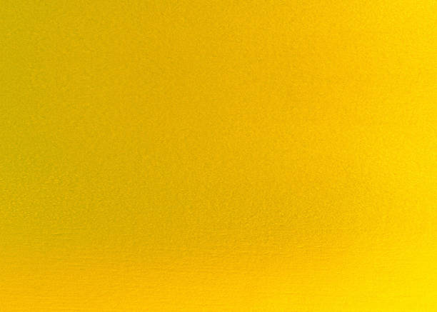 istock abstract background. shiny yellow of gold foil texture 954906882
