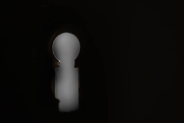 Macro close up of an old keyhole. Abstract background with plenty of copy space.