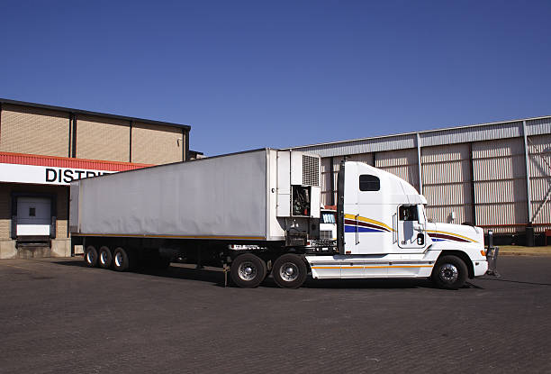 Freight transport. Trailer with a trailer. The car is being prepared for dispatch.