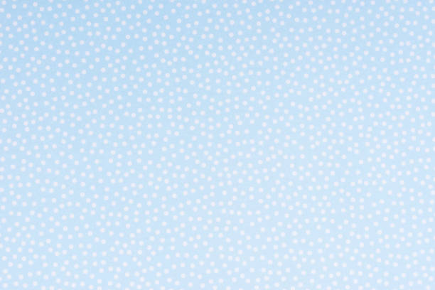 istock Bright blue paper with white spots and dots texture background. 954912786