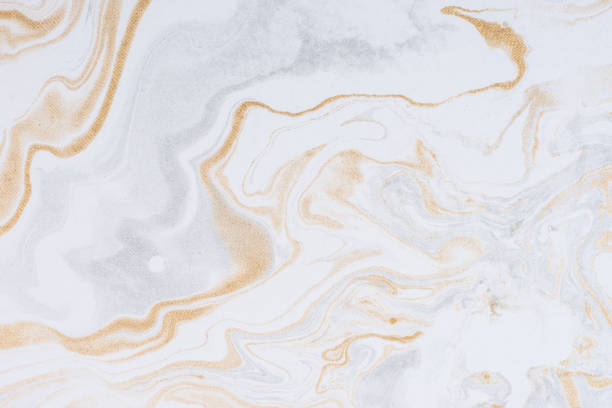 istock White paper sheet texture background. Flowing colors. Golden and silver fluid color pattern. 954912818